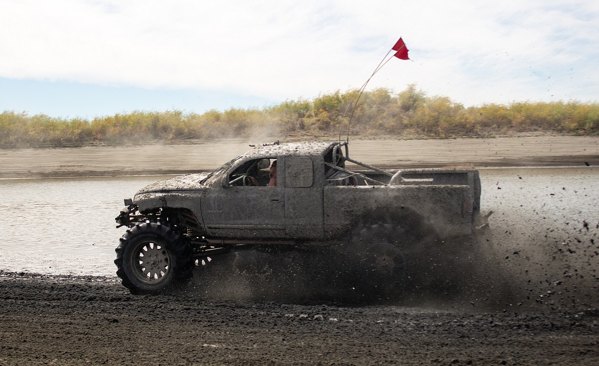 Casey McCarthy/Columbia Basin Herald
Moses Lake resident Justin Gilbert flies across the mud on Saturday afternoon at the annual Off Road Race Around the Bowls event, hosted by the Sand Scorpions ORV Group.