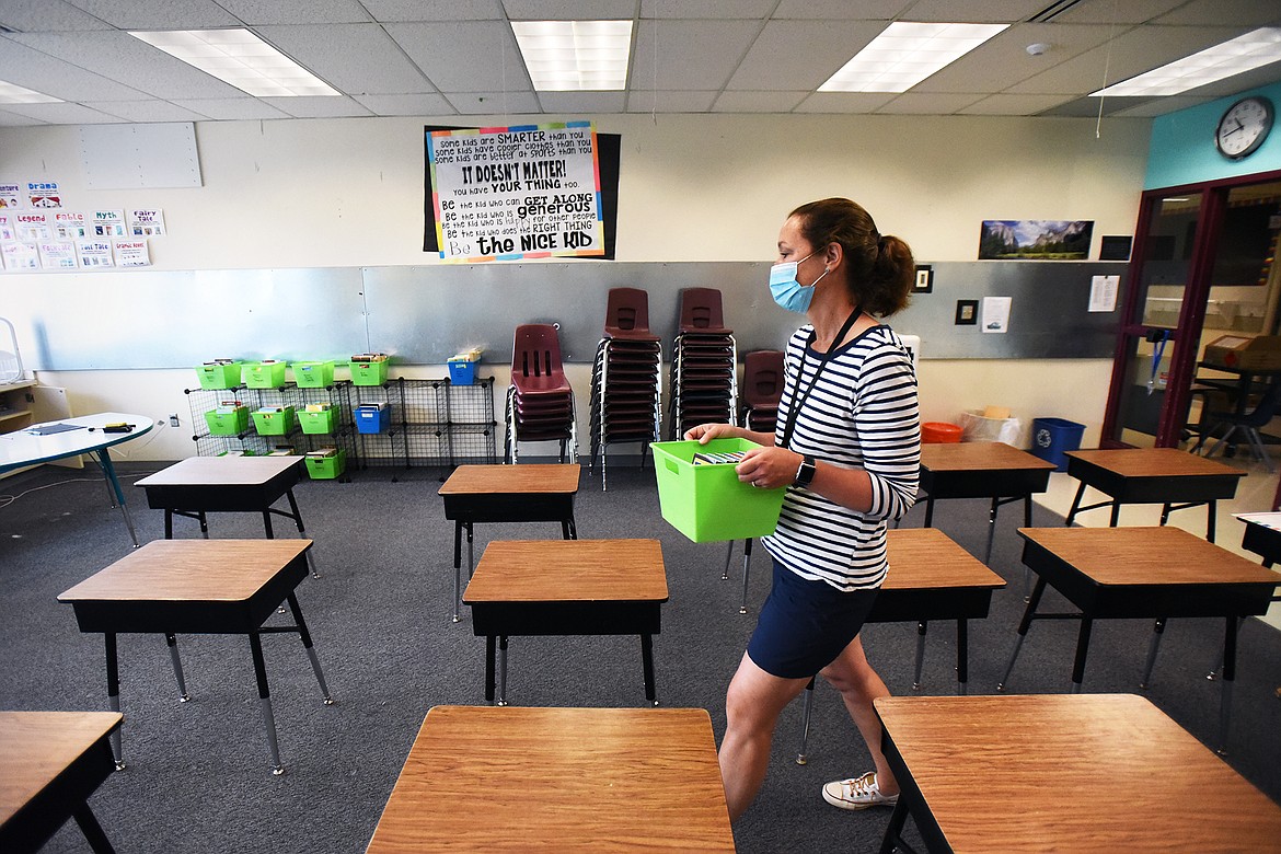 Carey Eshleman, a fifth-grade teacher at Edgerton Elementary School, gets her classroom library ready on Thursday, Aug. 20. (Casey Kreider/Daily Inter Lake)