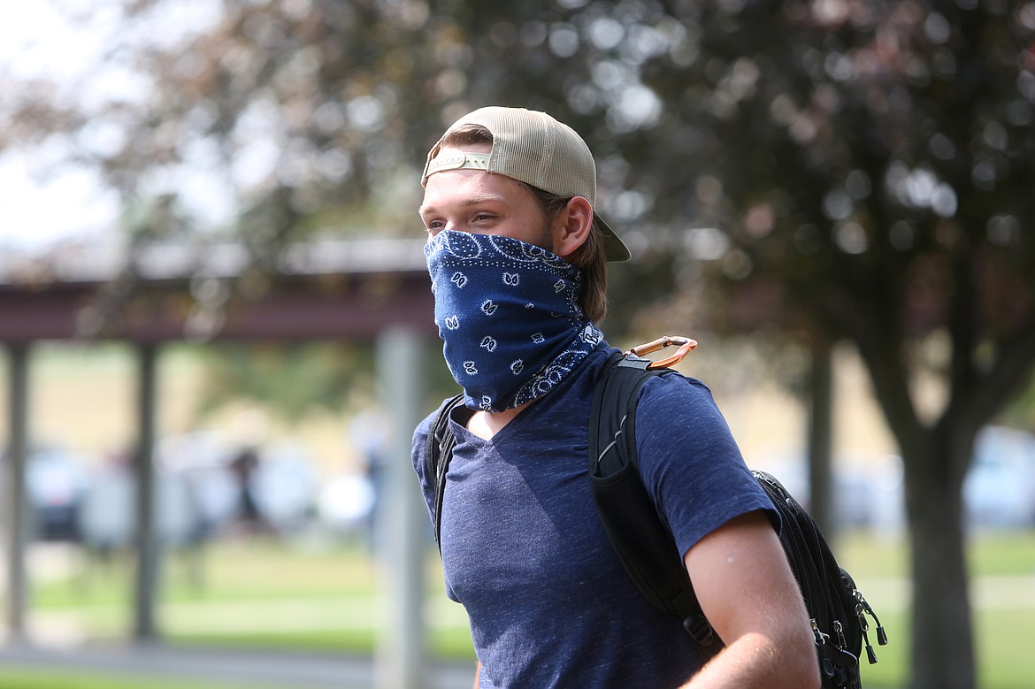 Caleb Karow, a communications student from Kalispell, heads to class at Flathead Valley Community College on the first day of the fall semester.