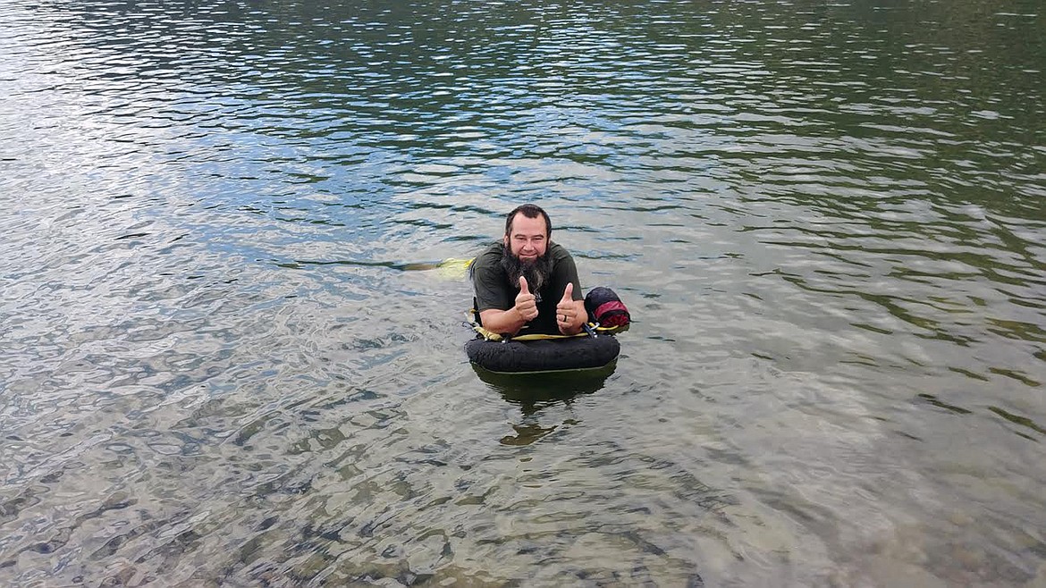 Army veteran Jesse Raymond enjoyed his time in the Horse Plains VFW river float last Saturday. (Chuck Bandel/Valley Press)