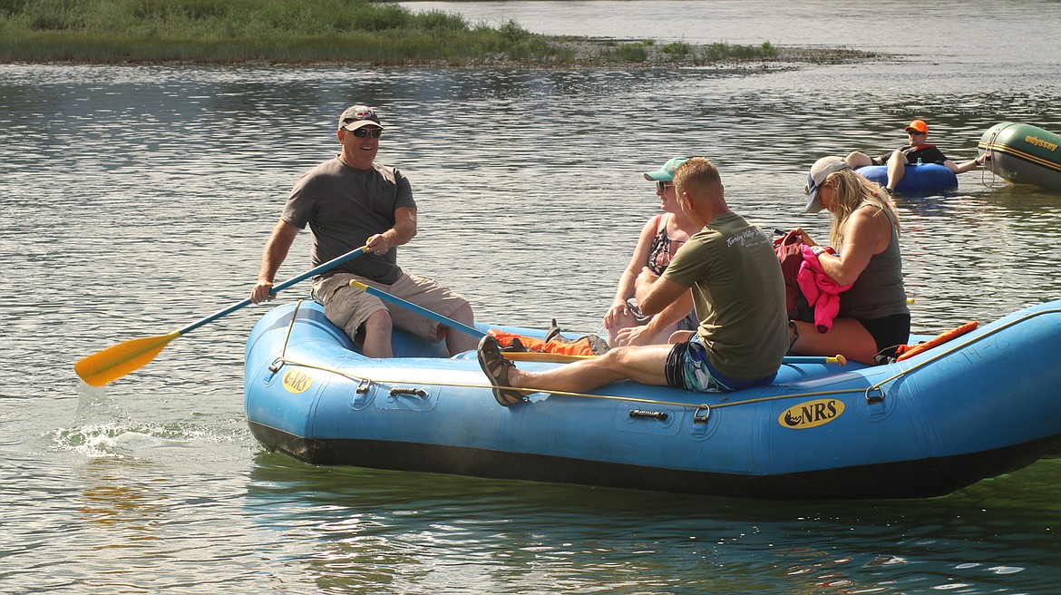 Montana state auditor candidate Troy Downing (with paddle) heads out from the Paradise landing starting point during last weekend’s VFW float on the Clark Fork River. (Chuck Bandel/Valley Press)