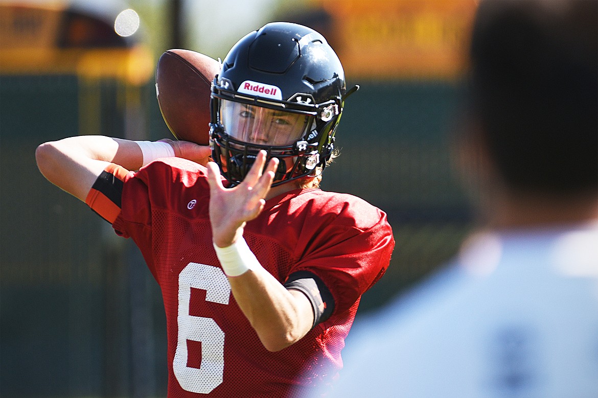 Flathead quarterback Charlie Hinchey warms up at practice at Legends Stadium on Wednesday, Aug. 26. (Casey Kreider/Daily Inter Lake)