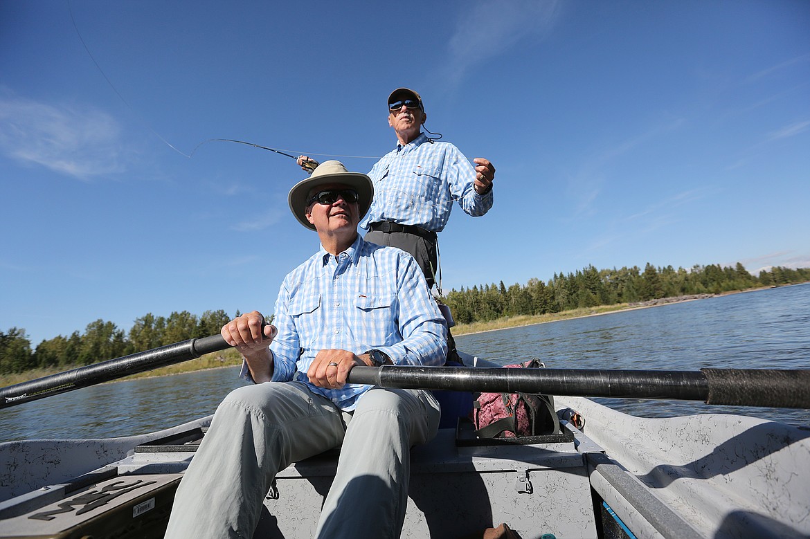 Flathead Valley Trout Unlimited board member Dan Short, front, and FVTU veterans coordinator Jim Borowski fish along the Flathead River. (Daily Inter Lake FILE)