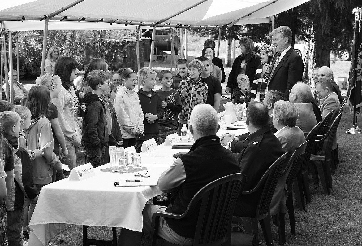 Idaho Gov. C.L. ‘Butch’ Otter addresses a group of Priest Lake Elementary School students during a Capitol For a Day event in Nordman on Sept. 19, 2011.