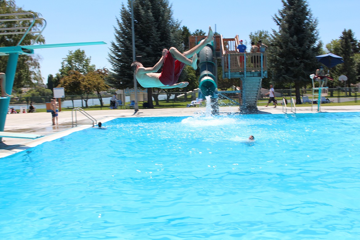 Remembrance of summers past — a diver tries to make a splash at the Surf ‘n Slide water park.