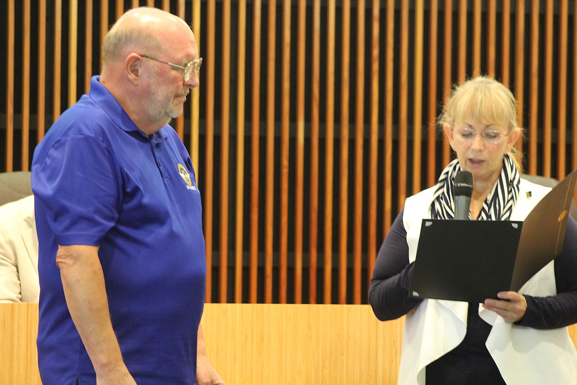 Moses Lake Mayor Karen Liebrecht reads aloud a Lifetime Achievement proclamation for Dennis Clay at a city council meeting in June 2018. Clay, a lifelong Moses Lake resident, with the exception of military duty, served in the U.S. Army for nine years, served 30 years with the Washington State Employment Security Department as the Disabled Veteran Outreach person and was a contributing writer for the Columbia Basin Herald for decades.