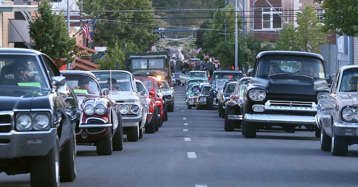 Vehicles from 1980 and earlier paraded through downtown Coeur d'Alene Friday night as part of the 28th annual Car d'Lane celebration, sponsored by the Coeur d'Alene Downtown Association. (JUDD WILSON/Press)