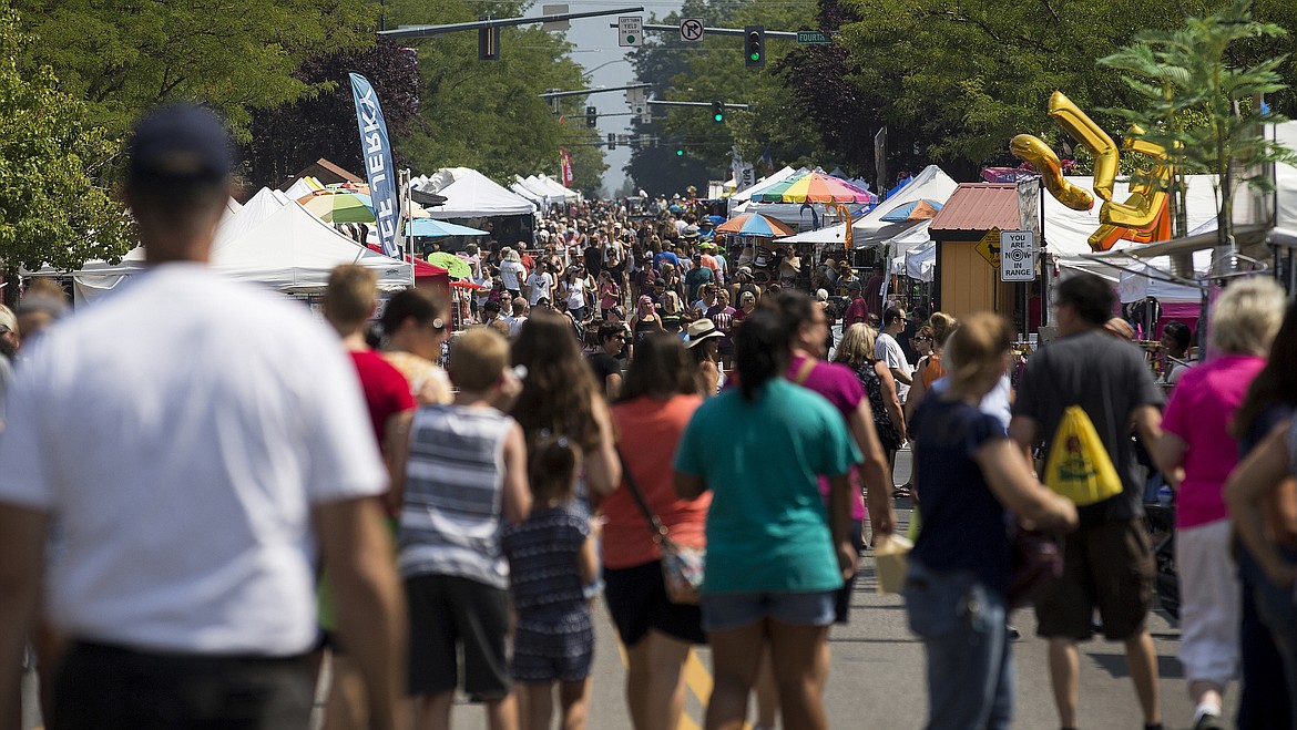 Thousands of people walk on Sherman Avenue during the Downtown Street Fair.