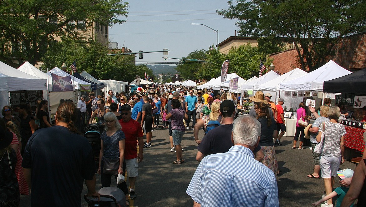 Thousands of people took advantage of moderate temperatures to enjoy the 2018 Coeur d'Alene Downtown Association's Downtown Street Fair. Although Art on the Green is going virtual this year, the Street Fair and the Taste of Coeur d'Alene are still a go as planned. (BRIAN WALKER/Press File)