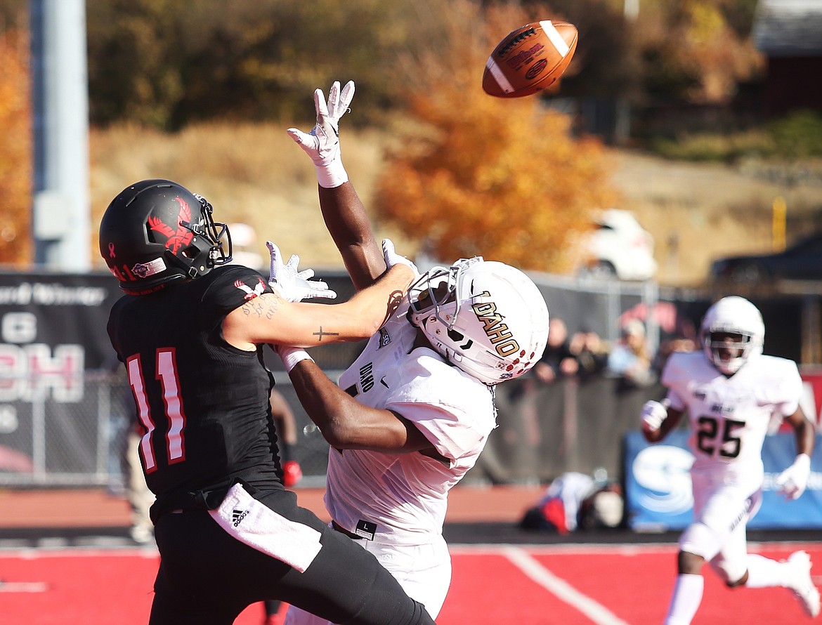 Idaho defensive back Denzel Brantley deflects the pass from Eastern Washington wide receiver Terence Grady in a 2018 game at Roos Field in Cheney. On Friday, the Big Sky Conference announced it was pushing conference play to the spring. Idaho is still attempting to play some nonconference games on campus in Moscow this fall.
