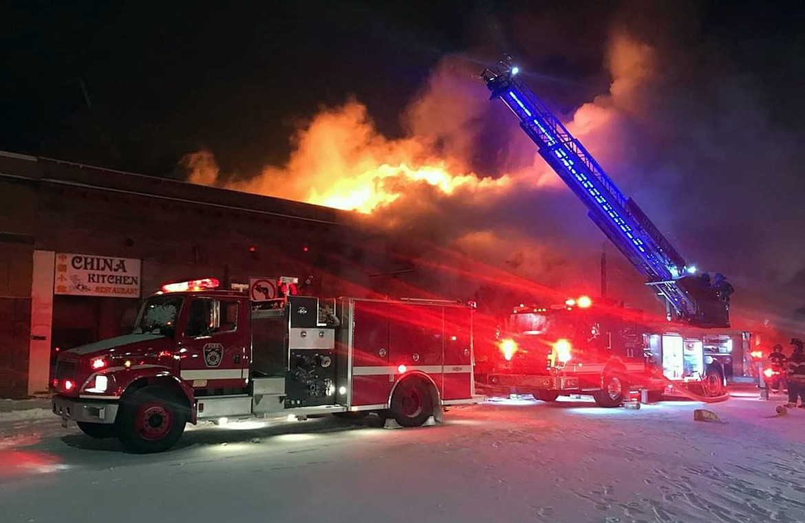 Flames and smoke pour from several buildings in Sandpoint’s Historic District in the early hours of Monday, Feb. 11, 2019, as fire crews from around the region work to bring the blaze under control.