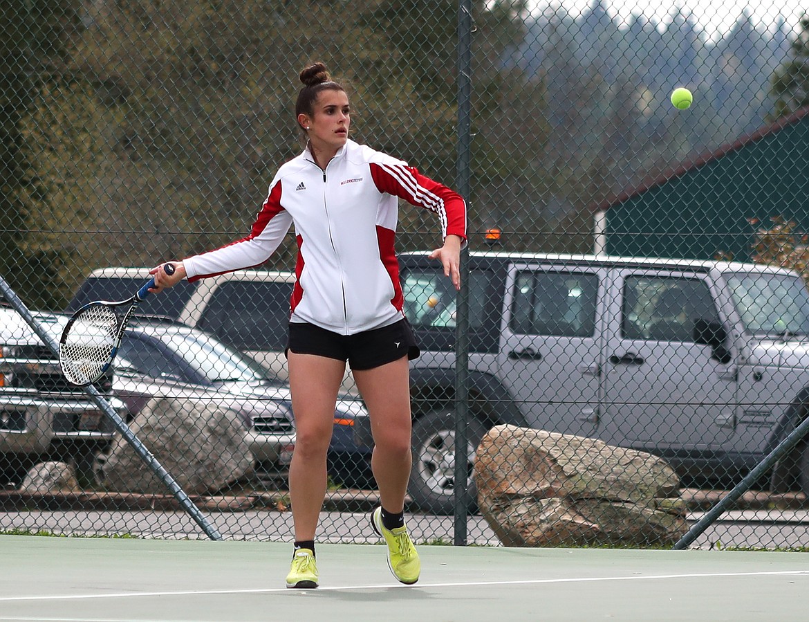 (Photo by KYLE CAJERO) 
 Sandpoint's Jenny Slaveck prepares to smash a forehand during a match against Post Falls on May 1, 2019. Slaveck is a finalist for the girls tennis award.