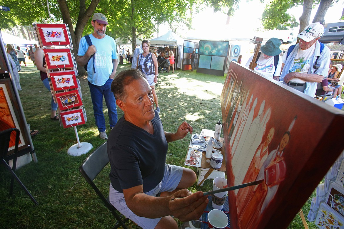 Daniel Ramirez, of Rio Rancho, N.M., paints contemporary Native American fine art during Art on the Green on the North Idaho College campus last summer. The 2020 Art on the Green live festival won't take place because of the global pandemic, but a virtual festival including opportunities to connect with artists and buy merchandise will be available online. (LOREN BENOIT/Press File)