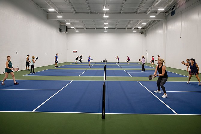 Photo by JEROME POLLOS PHOTOGRAPHY 
 The four pickle ball courts are filled with players at the Hayden Peak Fitness location.