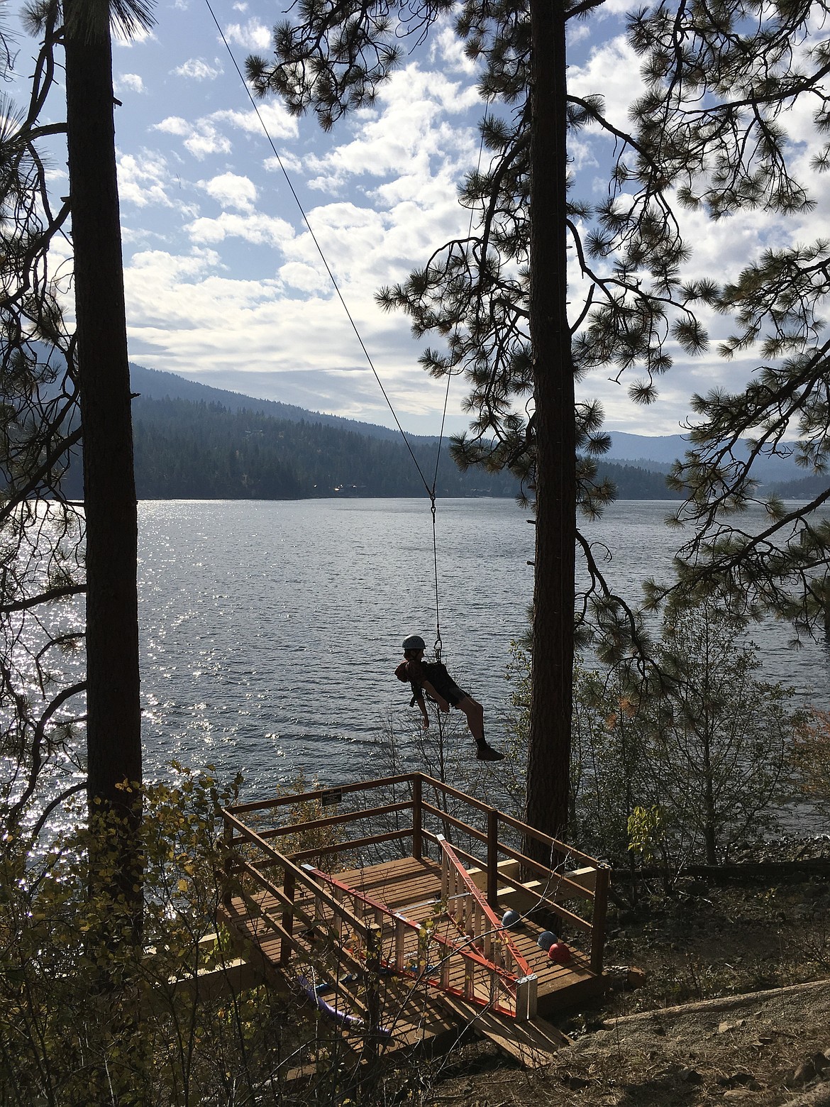 A swing carries camper Ethan Toomey over the lake at Camp Lutherhaven in 2019. This year, traditional summer camp will be suspended because of the coronavirus pandemic, but Lutherhaven is offering alternative options for families and congregations to enjoy at all three of its locations. (Courtesy of Karen Toomey)
