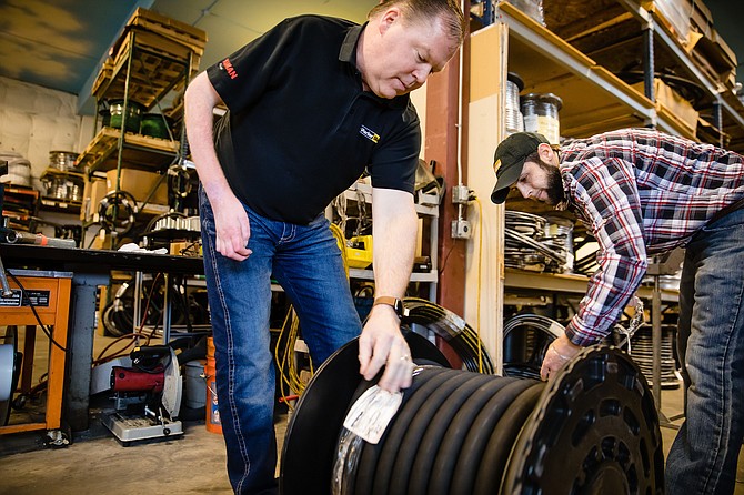 Photo by JEROME POLLOS PHOTOGRAPHY
Bryan Dykstra, branch lead of Kaman Power Fluid in Coeur d’Alene, assists Brandon Vaughn with preparing a customer order.