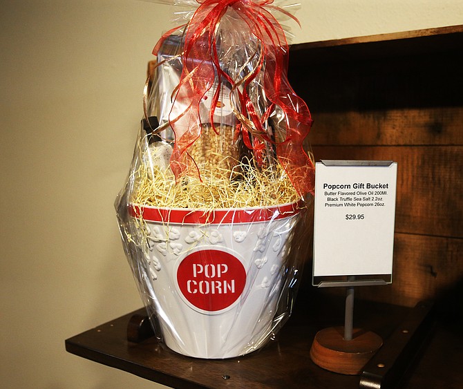This basket is full with olive oil, sea salt truffle, popcorn, perfect for a movie night. It’s one example of the fancy wrapping Migliore Olive Oil in Coeur d’Alene does for its customers every day.