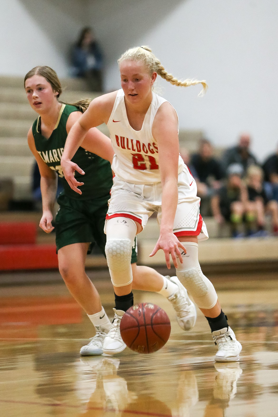 (Photo courtesy of JASON DUCHOW PHOTOGRAPHY) 
 Junior Hattie Larson drives toward the hoop during a game against St. Maries on Nov. 19 at Les Rogers Court.