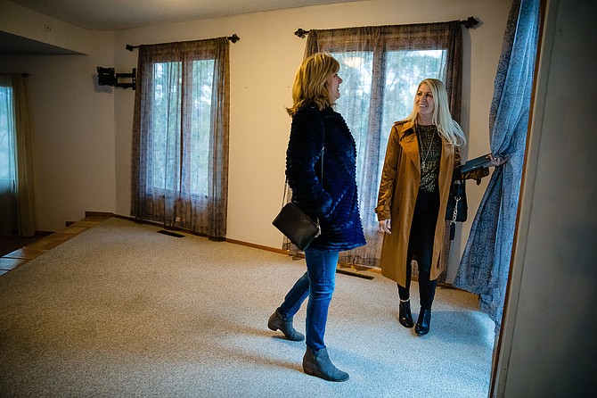 Gail Hewett, an associate broker with Lakeshore Realty, shows a property on Tubbs Hill to Sandy Gothard, a potential buyer from out-of-state, during home tours in Coeur d’Alene.