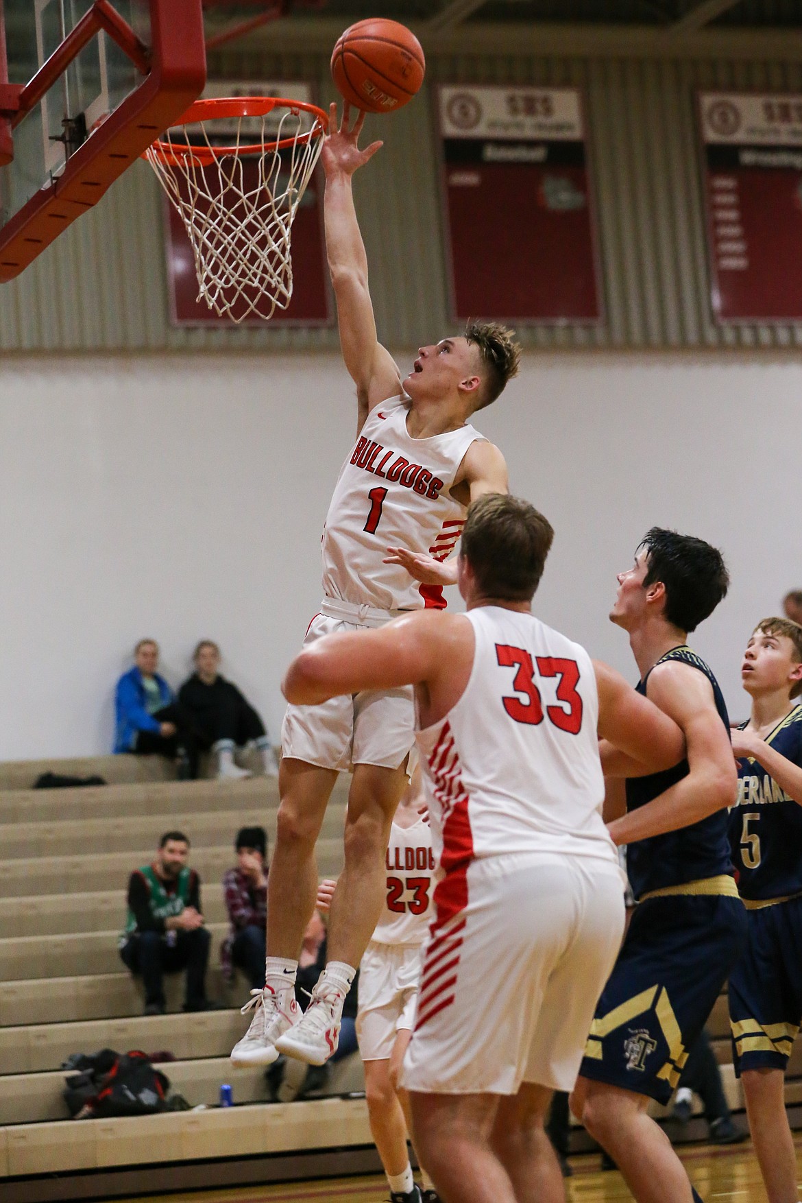 (Photo courtesy of JASON DUCHOW PHOTOGRAPHY) 
 Senior Ryan Roos converts a layup during a game this season at Les Rogers Court.