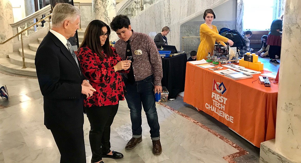Idaho Rep. Tony  Wisniewski, R-Post Falls, learns about robotics from FIRST Tech Challenge participants in the University of Idaho Extension 4-H robotics program at the fifth annual STEM Matters! cel