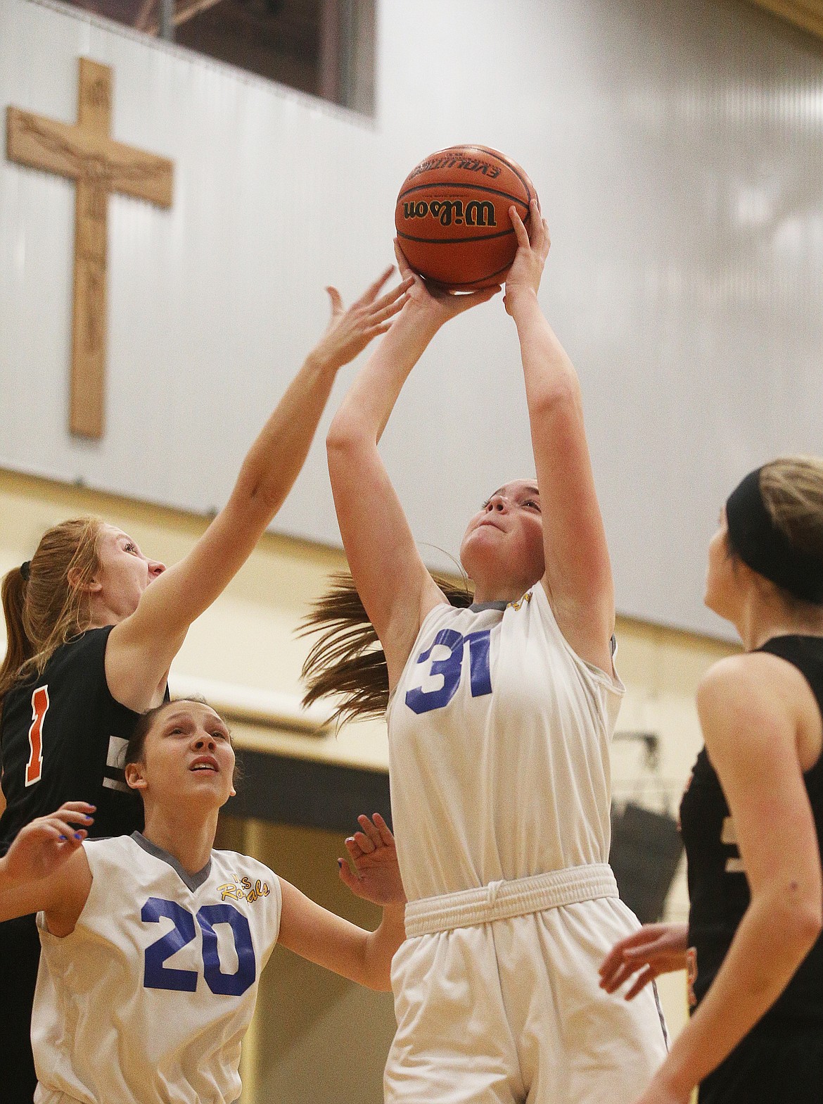 North Idaho Christian’s Imelda Bresee gathers a rebound in a game against Priest River last Wedneday at Holy Family Catholic School in Coeur d’Alene.