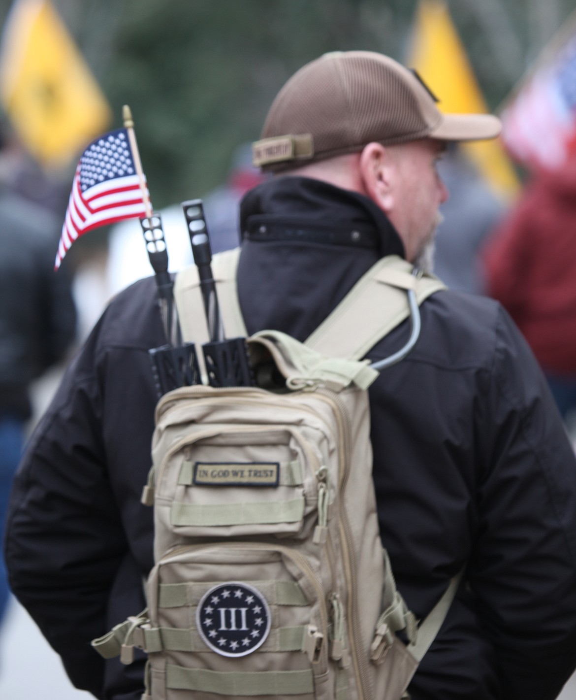 A man walks on the sidewalk between The Resort Shops and the parking garage on the way to McEuen Park, where the Second Amendment Rally in support of Virginia Second Amendment rights was held Monday.