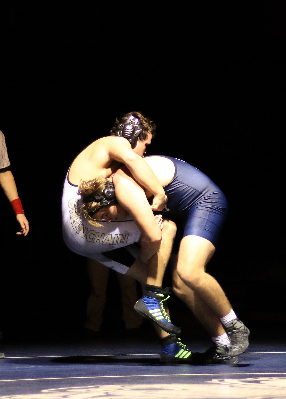 Photo by MANDI BATEMAN 
 Cooper Love takes down his opponent during an exhibition match against Kellogg on Jan. 21.
