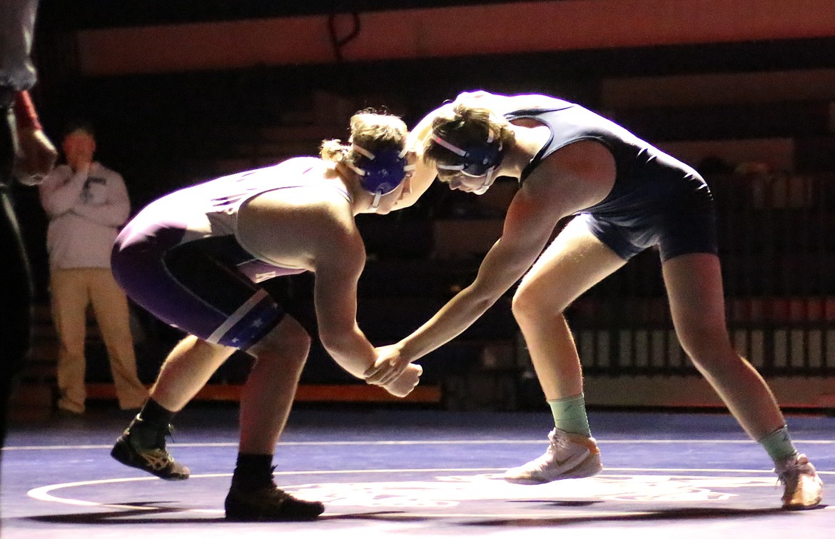 Andrew Sandelin, wrestling up at 220 pounds, grapples with Kellogg’s Otto Sharp during the Badgers’ Jan. 21 dual meet against the visiting Wildcats.