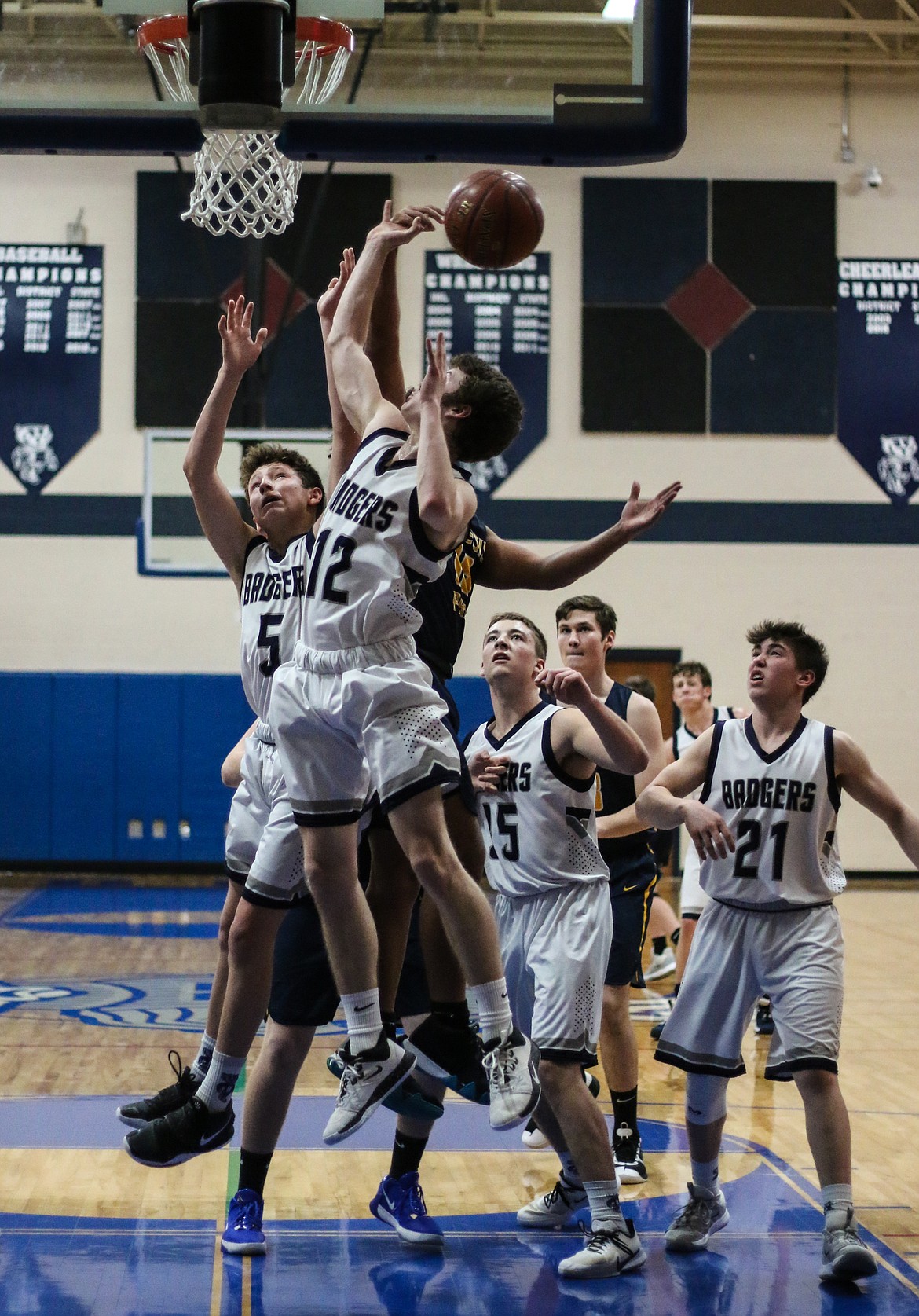 Photo by MANDI BATEMAN 
 Hayden Stockton drives to the basket during the make up game against Genesis preparatory Academy last Friday.