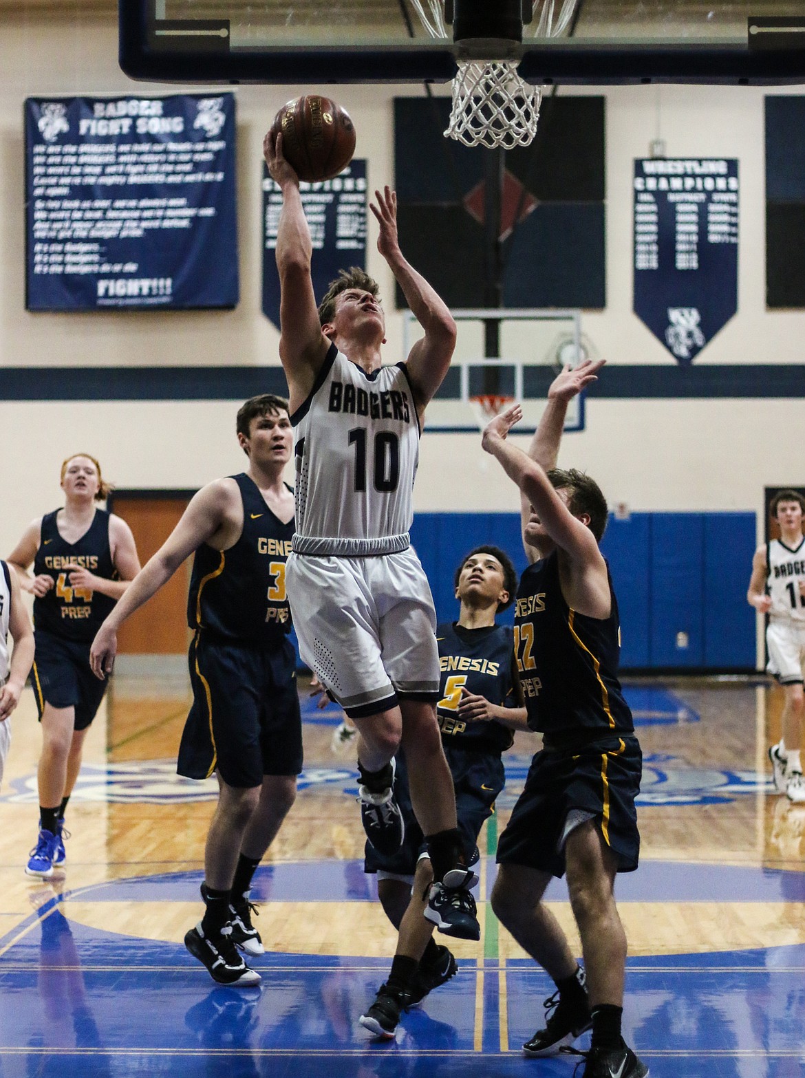 Ty Bateman drives to the basket during the Badgers’ Friday, Jan. 24, loss to visiting Genesis Prep.