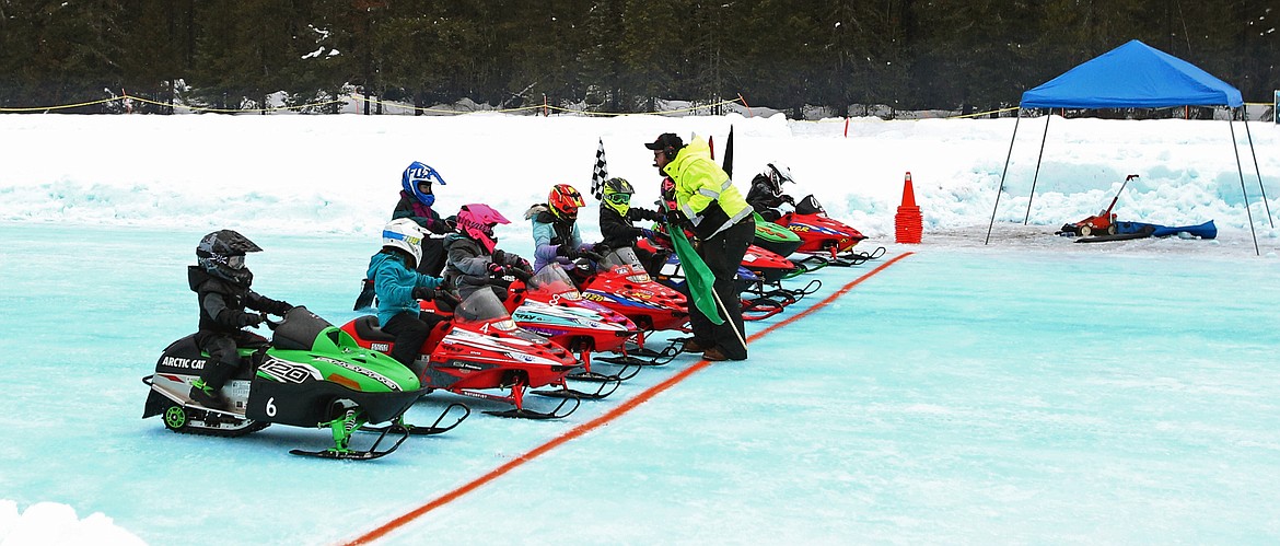 Junior competitors line up at the start of the 120 stock Priest Lake Vintage Snowmobile Race on Saturday.