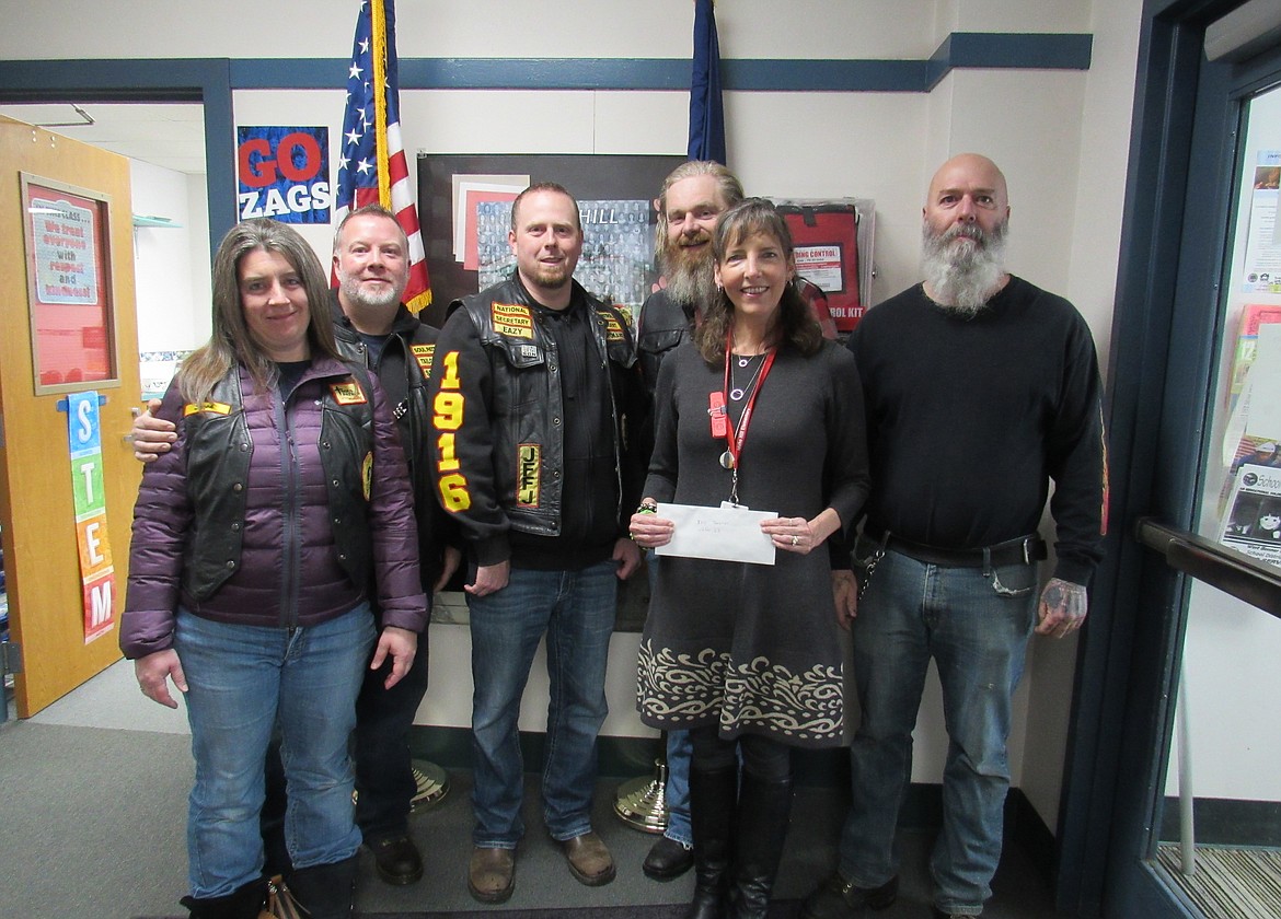 Soul Patrol recently donated $250 in support of Idaho Hill Elementary’s afterschool program. Pictured are members of Soul Patrol with Idaho Hill principal Susie Luckey.