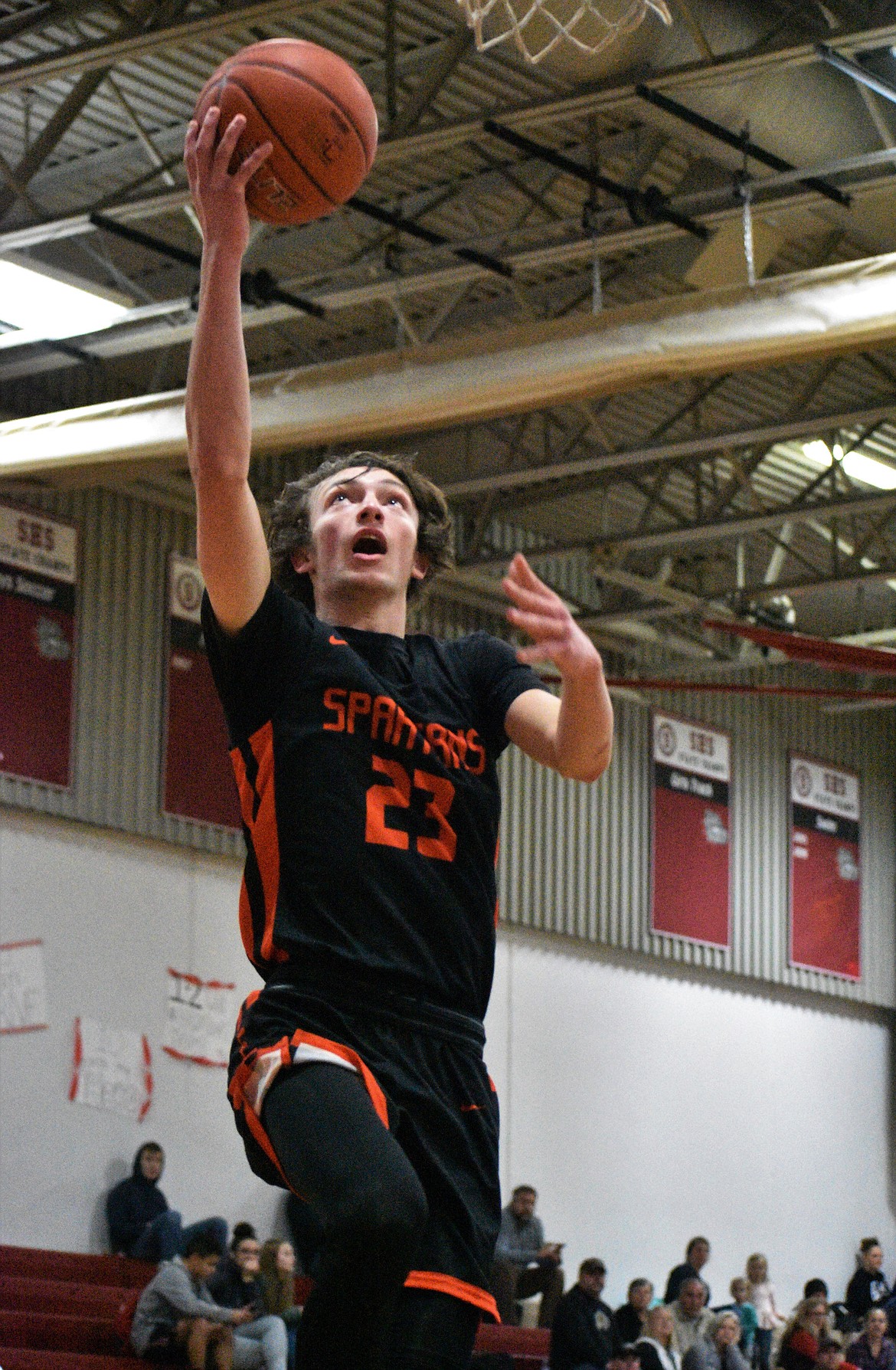 (File photo by DYLAN GREENE) 
 Senior Caden Brennan elevates for a layup during a game at Sandpoint on Jan. 24.