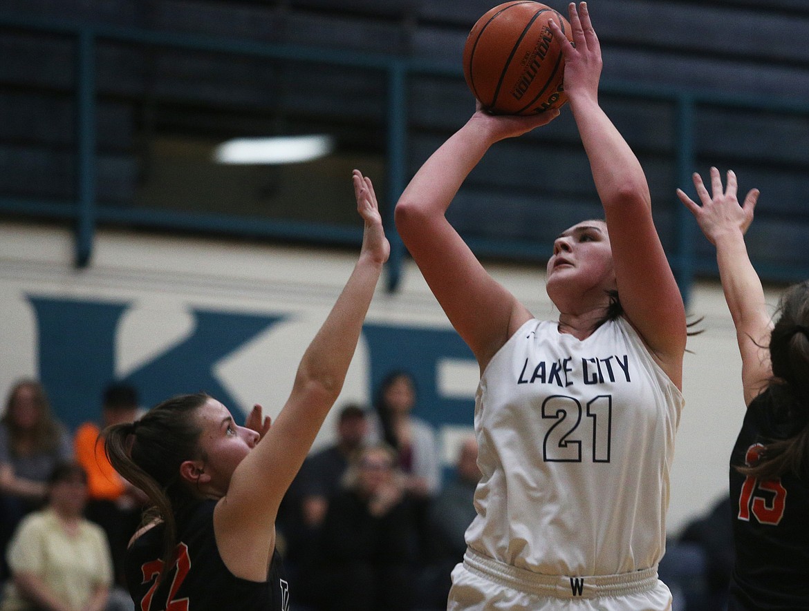 Lake City’s Brooklyn Rewers scores over Post Falls’ Kennedy LaFountaine in a 2020 game at Lake City.