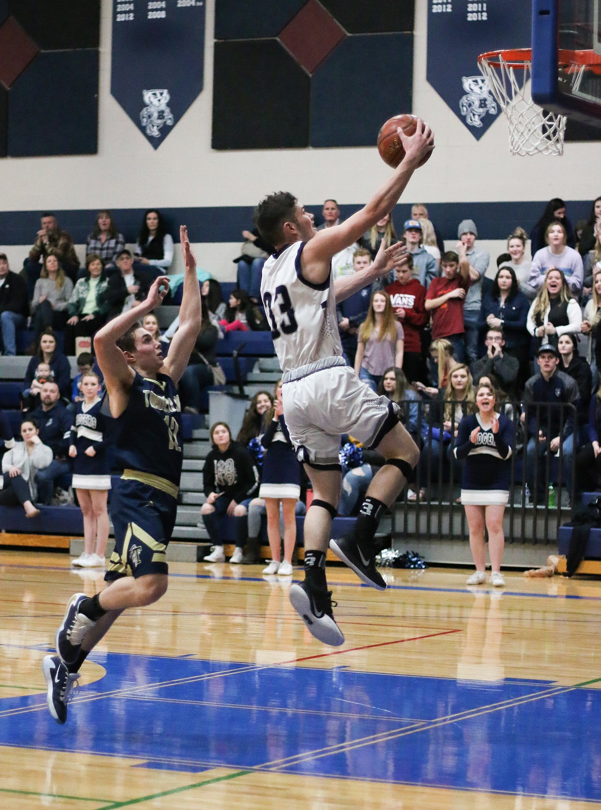 Photo by MANDI BATEMAN 
 Braeden Blackmore goes for a slam dunk during the Jan. 28 home game against Timberlake.