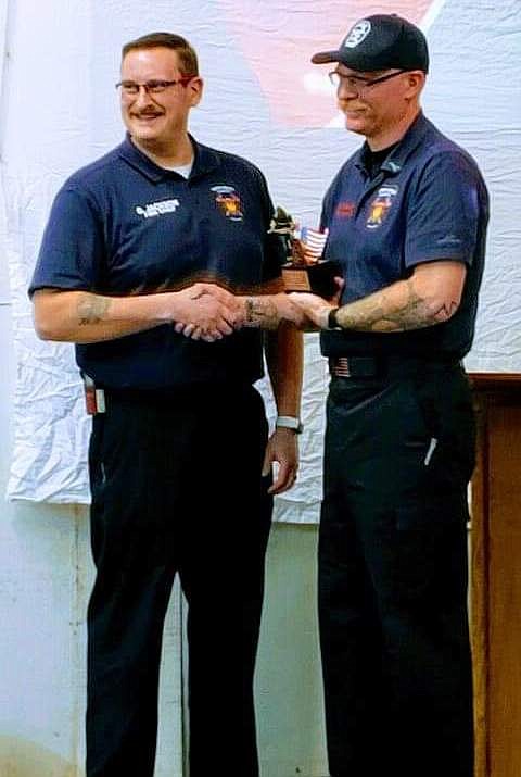North Bench Fire Chief Gus Jackson presents North Bench Firefighter Tom Chaney the Firefighter of the Year award.