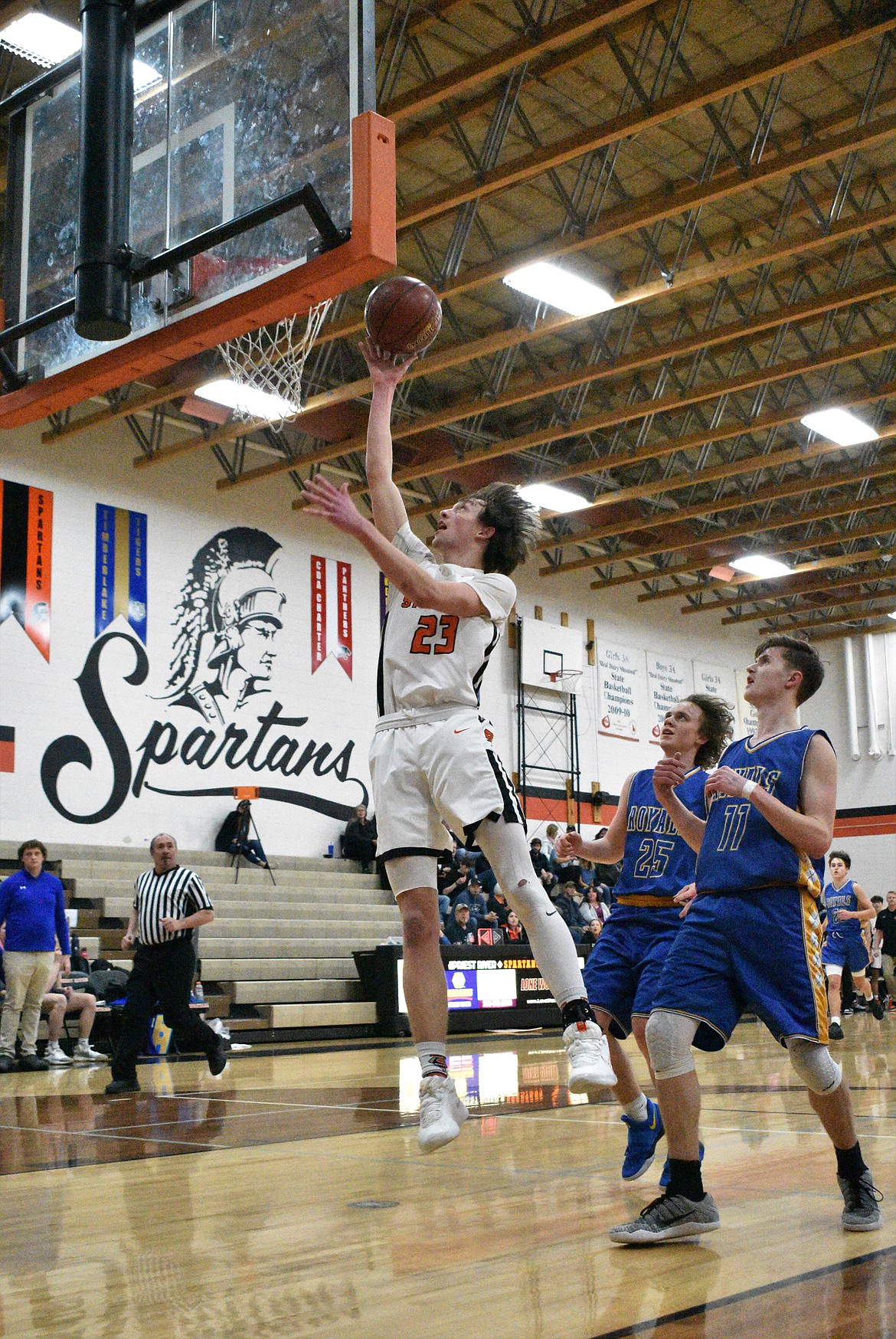 (Photo by DYLAN GREENE) 
 Senior Caden Brennan converts a layup on the fast break during a game against North Idaho Christian last Thursday.