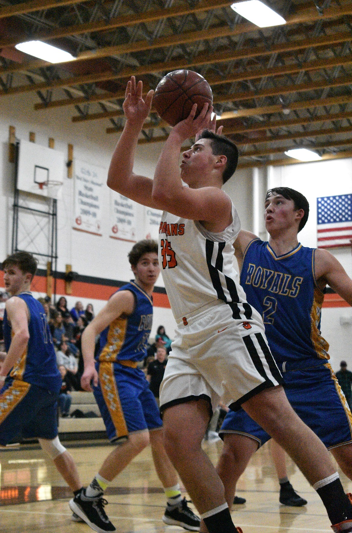 (Photo by DYLAN GREENE) 
 Freshman Jace Yount goes up for a shot against North Idaho Christian last Thursday.