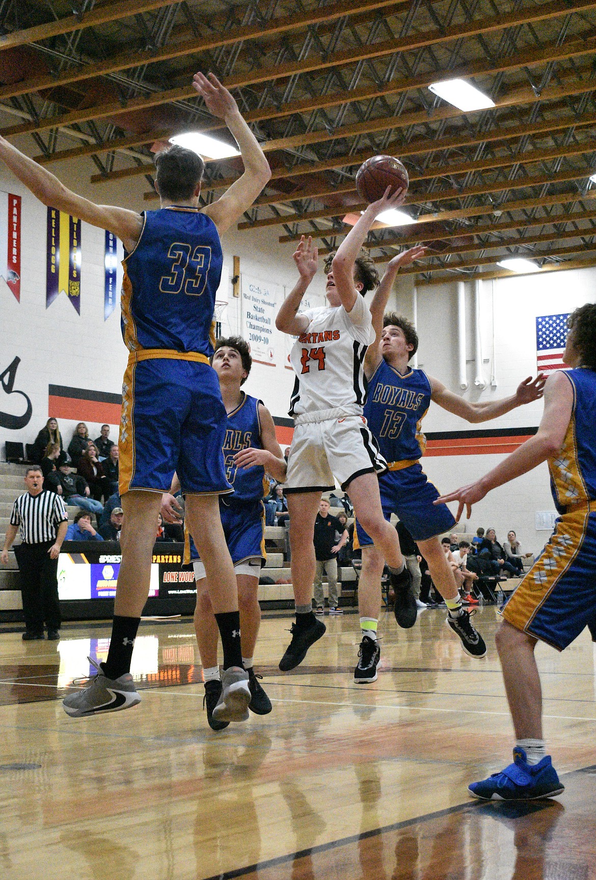 (Photo by DYLAN GREENE) 
 Sophomore Trentyn Kreager fights through the heart of the North Idaho Christian defense to attempt a shot last Thursday.