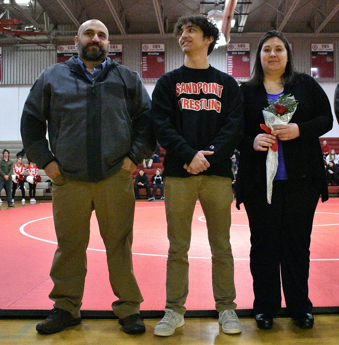 (Photo by DYLAN GREENE) 
 Jake Ryan celebrates senior night with his family.