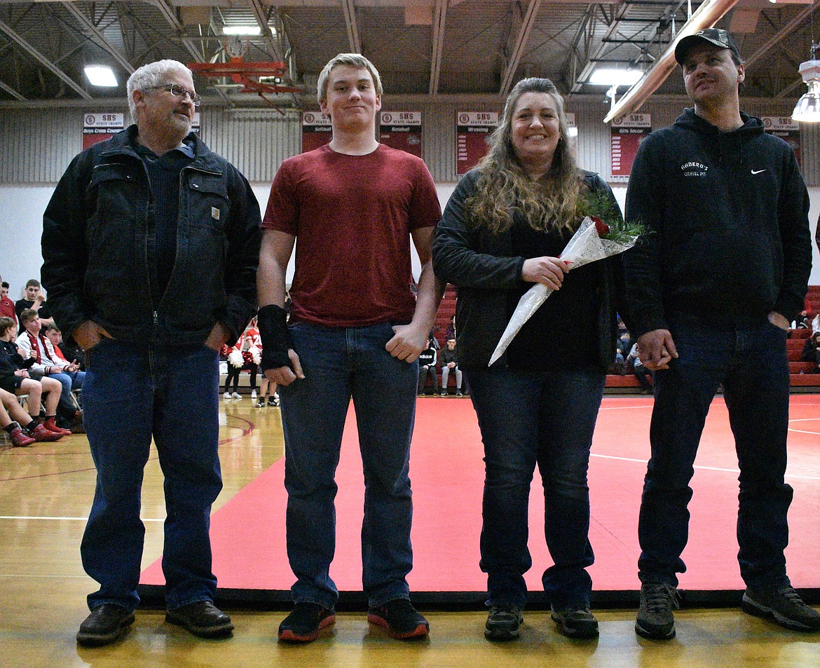 (Photo by DYLAN GREENE) 
 Jake Suhr celebrates senior night with his family.