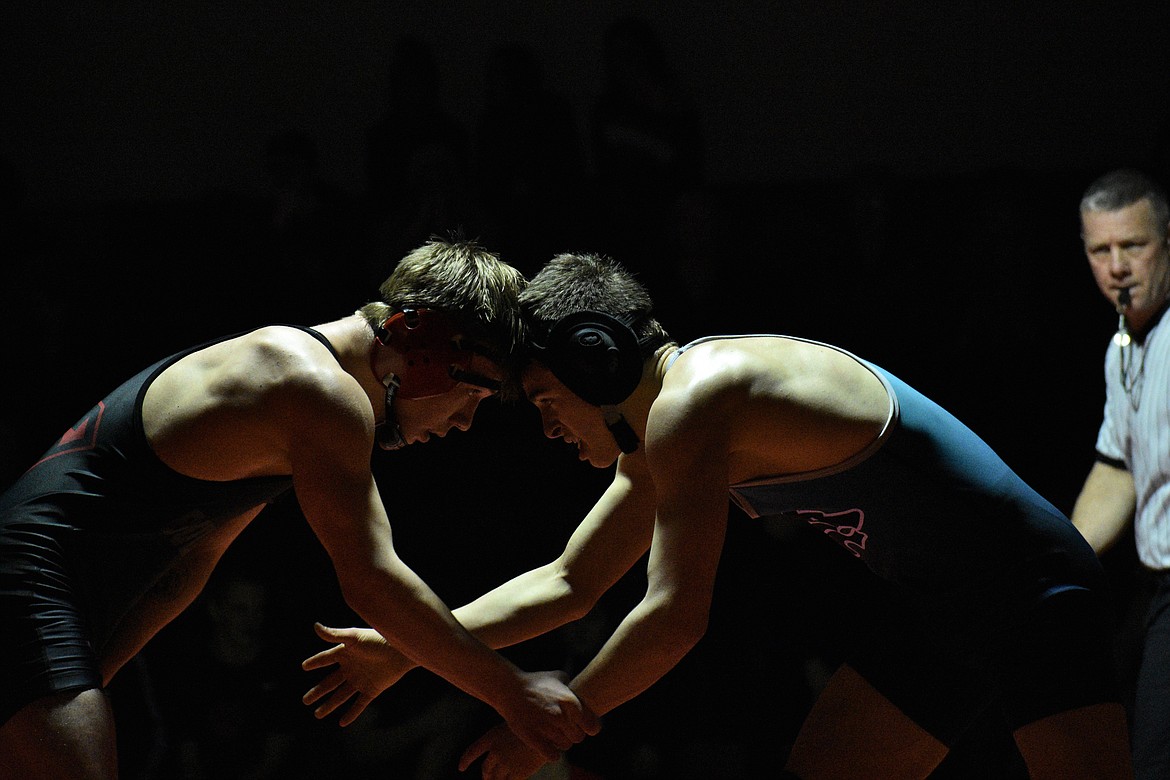 Senior Malachi Fleck faces off with Lake City’s Ayden Johnson at 138 pounds Wednesday night.