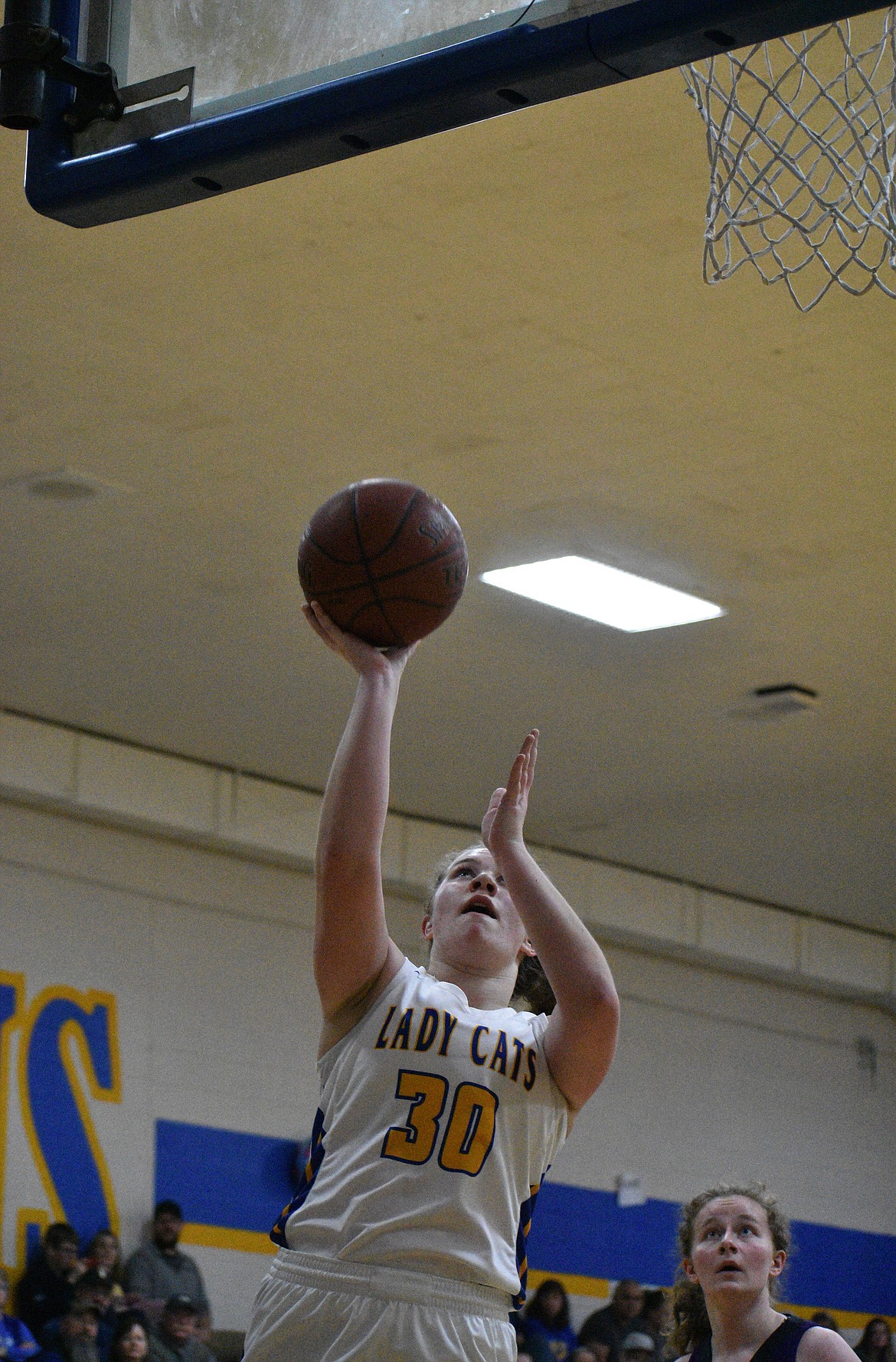 (Photo by DYLAN GREENE) 
 Senior Ellie Kiebert goes up for a layup after getting a steal against Mullan on Thursday.