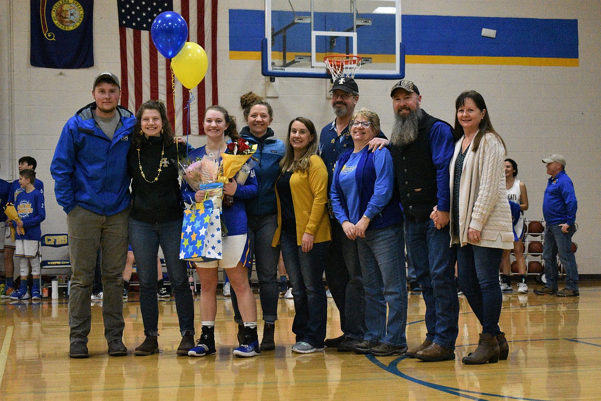 (Photo by DYLAN GREENE) 
 Senior Ellie Kiebert celebrates senior night with her family and friends.