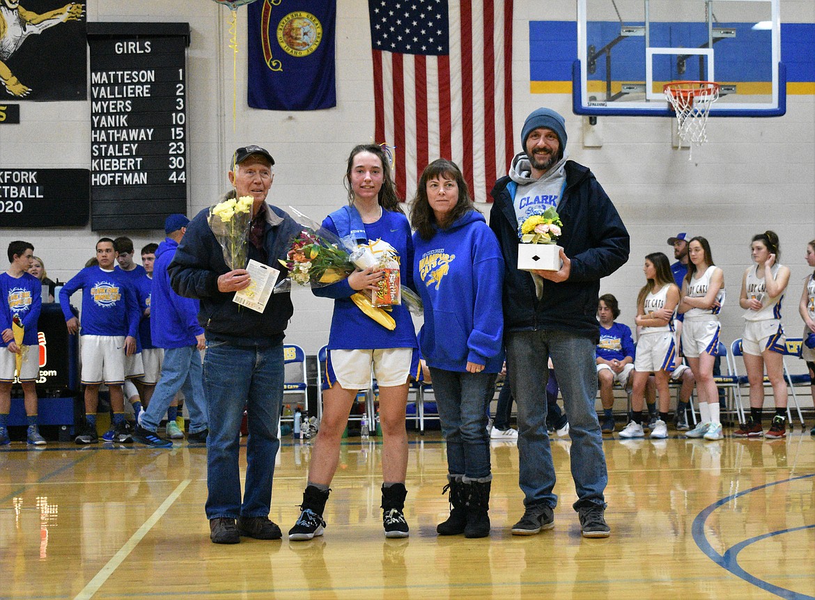 (Photo by DYLAN GREENE) 
 Senior Sara Hathaway celebrates senior night with her family.