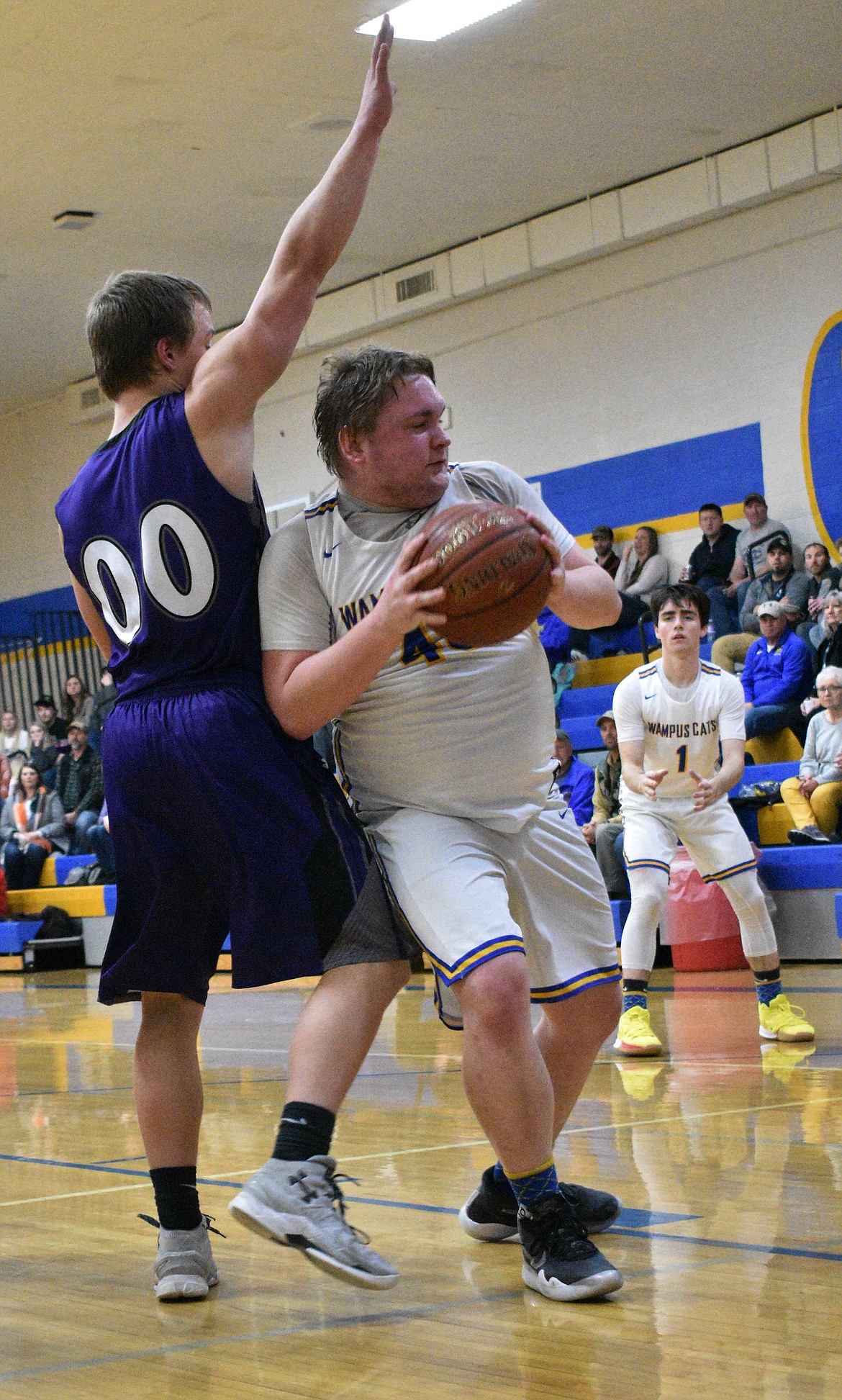 (Photo by DYLAN GREENE) 
 Senior Charlie Abbott tries to fight past a Mullan defender Thursday.