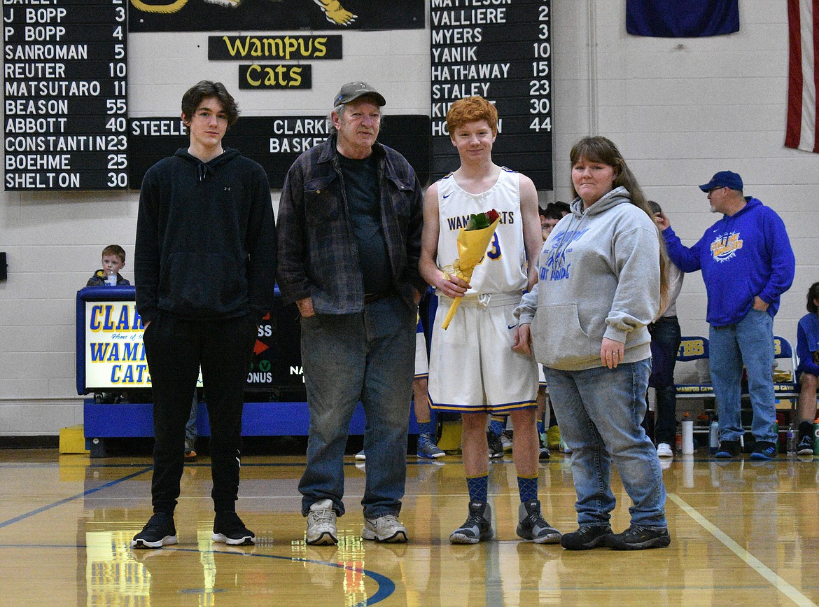 (Photo by DYLAN GREENE) 
 Senior Isaac Steele celebrates senior night with his family.