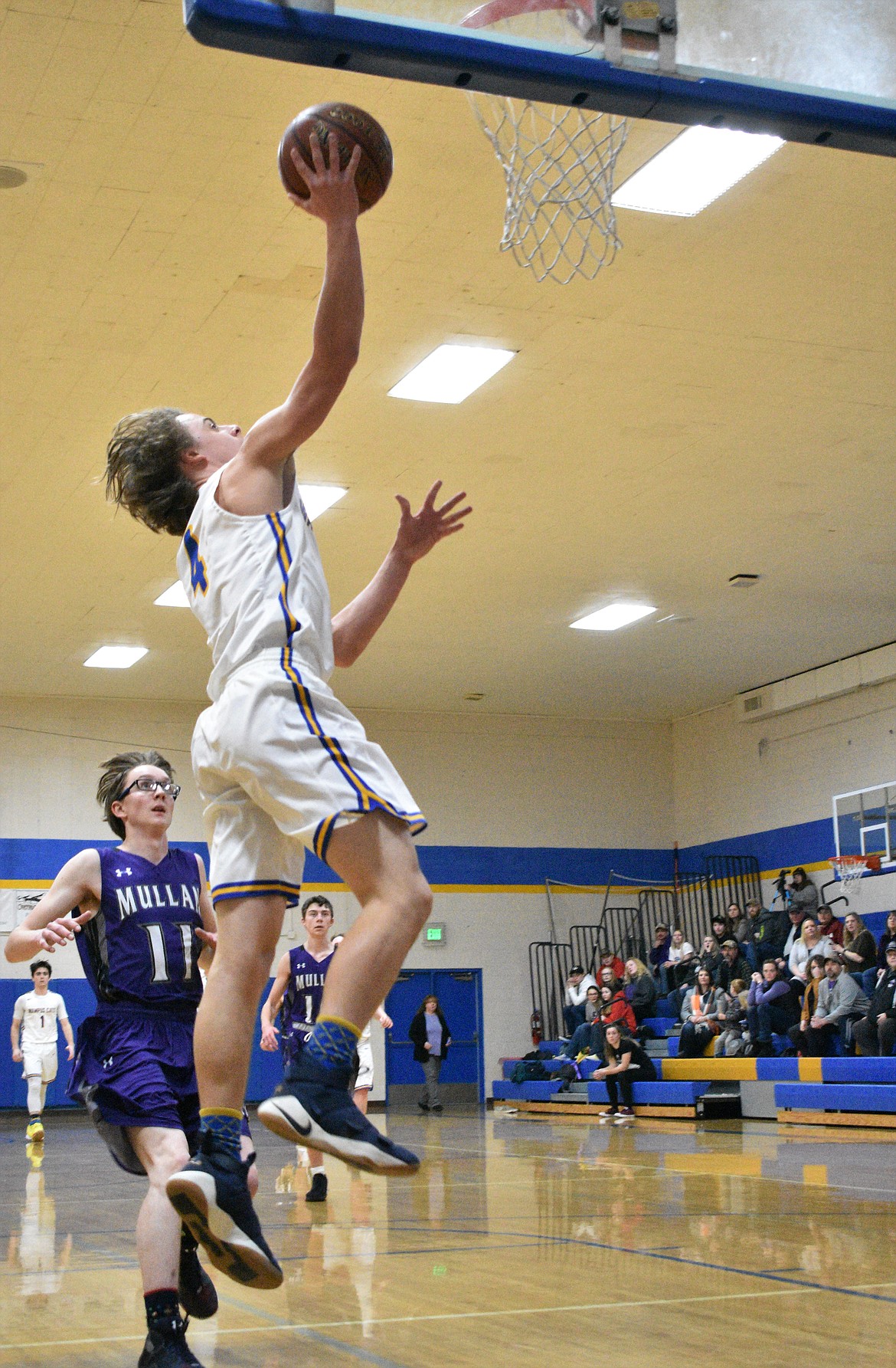 (Photo by DYLAN GREENE) 
 Senior Paul Bopp elevates for a layup Thursday against Mullan.