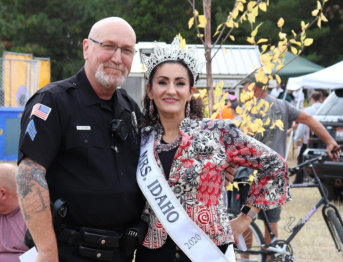 Katherine Funk-Adlard, right,  poses with Ponderay Police’s Mike Victorino at Ponderay Days where she worked to promote the local option tax, which will raise money for the Bay Trail underpass and the city’s Field of Dreams project.